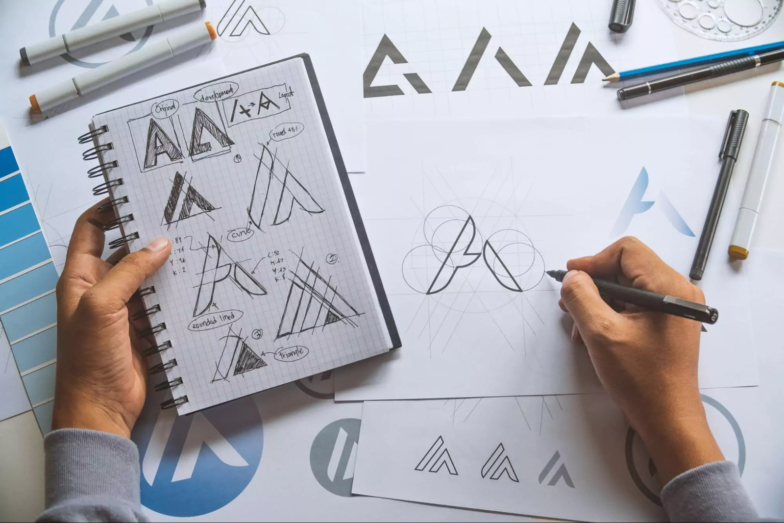 A graphic designer sketching a new logo